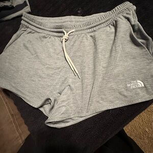 The Northface knit shorts. Size medium and large. Grey in color